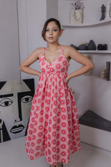 Pink spaghetti strap midi dress with red daisy block print and sweetheart neckline