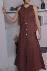 Close-up of off-centre wooden buttons on handloom brown khadi fabric