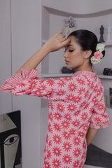 Back of pink ruffle mini dress with relaxed fit and soft gathers