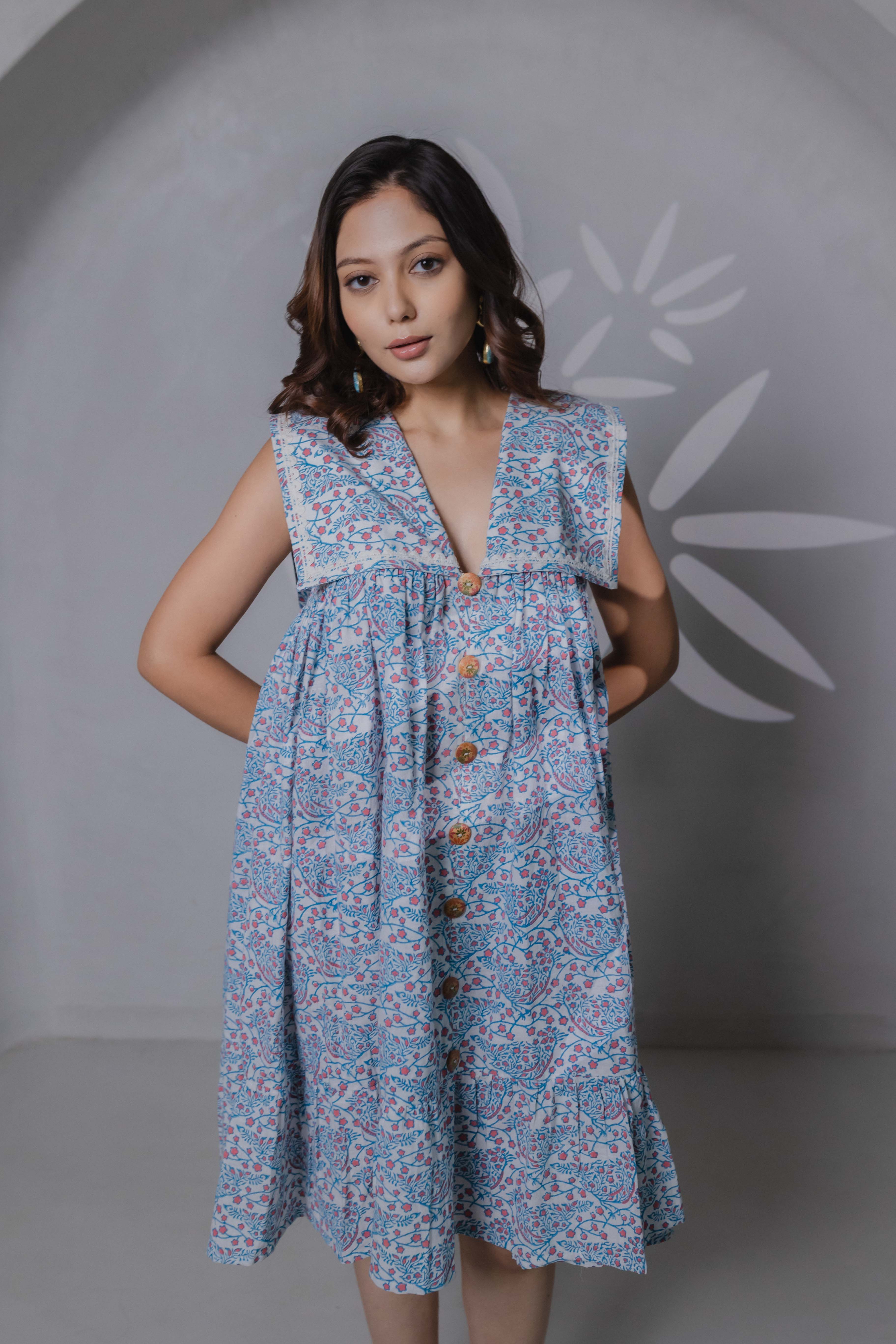 Close-up of bird block print and sailor collar detail on blue khadi cotton