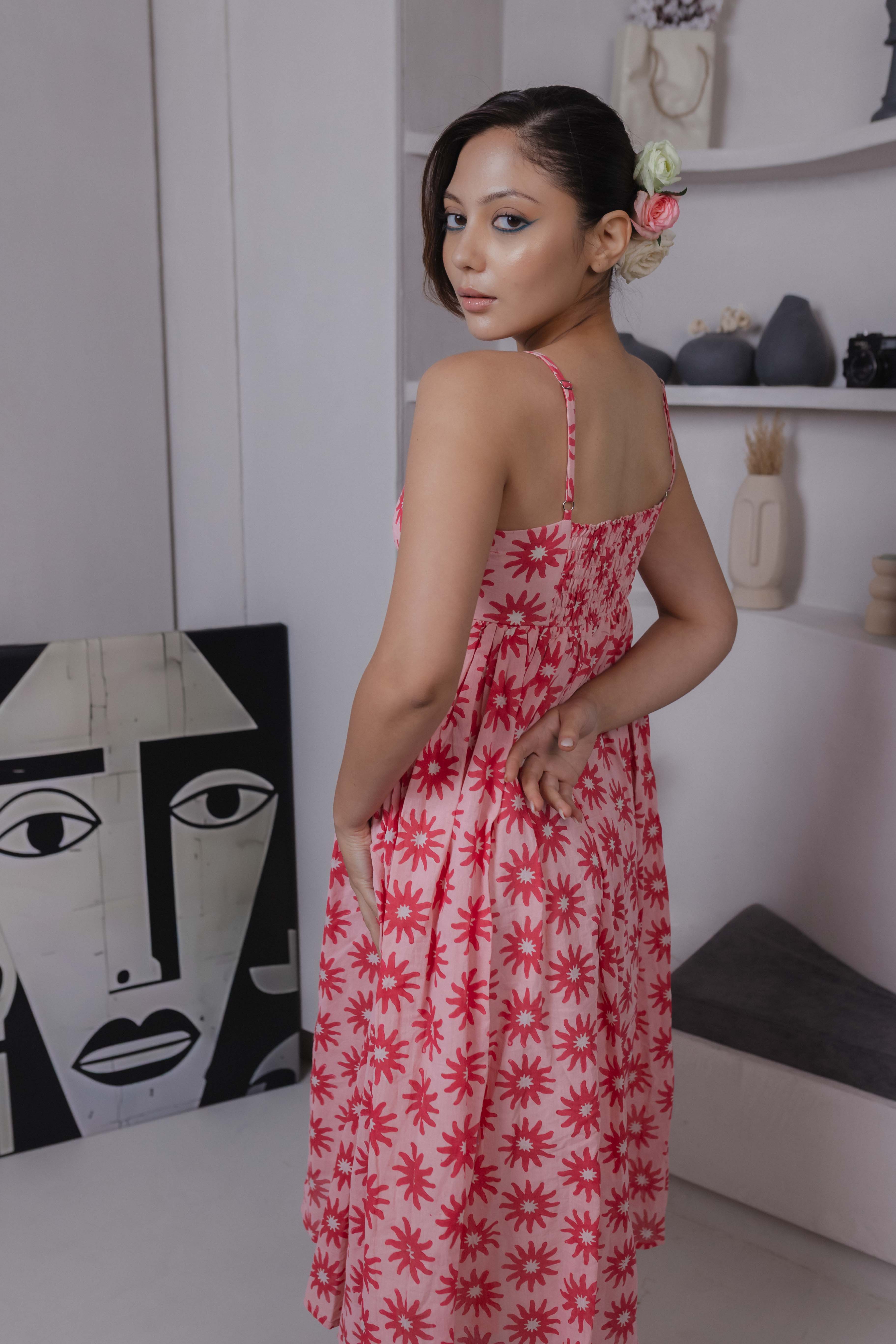 Smocked back detail of pink cotton silk block-printed midi dress